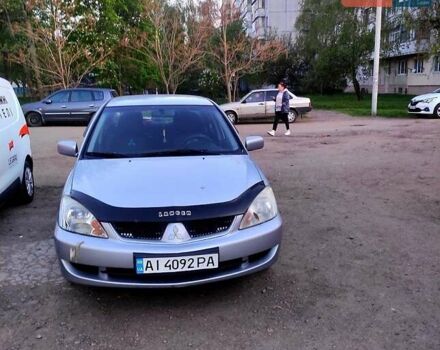 Серый Мицубиси Лансер, объемом двигателя 1.6 л и пробегом 302 тыс. км за 3200 $, фото 5 на Automoto.ua
