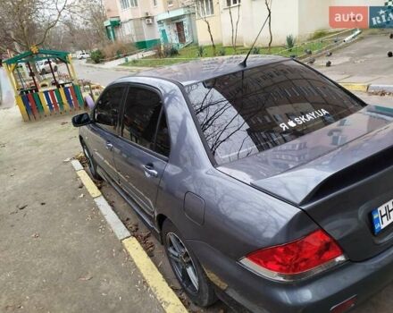 Сірий Міцубісі Lancer, об'ємом двигуна 1.58 л та пробігом 250 тис. км за 4750 $, фото 5 на Automoto.ua