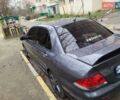 Сірий Міцубісі Lancer, об'ємом двигуна 1.58 л та пробігом 250 тис. км за 4750 $, фото 5 на Automoto.ua