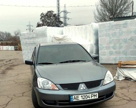 Серый Мицубиси Лансер, объемом двигателя 1.6 л и пробегом 220 тыс. км за 4200 $, фото 1 на Automoto.ua
