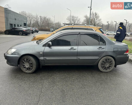 Серый Мицубиси Лансер, объемом двигателя 1.6 л и пробегом 242 тыс. км за 4200 $, фото 2 на Automoto.ua