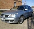 Сірий Міцубісі Lancer, об'ємом двигуна 1.6 л та пробігом 142 тис. км за 4700 $, фото 2 на Automoto.ua