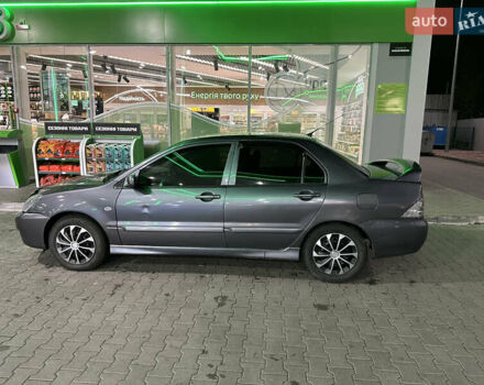 Серый Мицубиси Лансер, объемом двигателя 1.6 л и пробегом 112 тыс. км за 2800 $, фото 1 на Automoto.ua