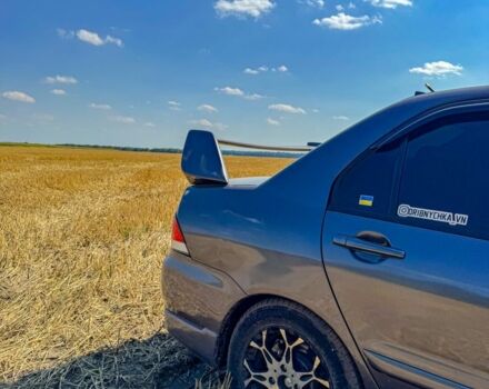 Серый Мицубиси Лансер, объемом двигателя 1.6 л и пробегом 280 тыс. км за 4000 $, фото 3 на Automoto.ua