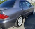 Сірий Міцубісі Lancer, об'ємом двигуна 1.6 л та пробігом 293 тис. км за 5000 $, фото 4 на Automoto.ua