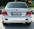 Сірий Міцубісі Lancer, об'ємом двигуна 1.6 л та пробігом 260 тис. км за 4600 $, фото 17 на Automoto.ua