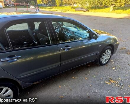 Серый Мицубиси Лансер, объемом двигателя 1.6 л и пробегом 225 тыс. км за 3200 $, фото 8 на Automoto.ua