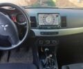 Серый Мицубиси Лансер, объемом двигателя 1.5 л и пробегом 210 тыс. км за 6100 $, фото 6 на Automoto.ua