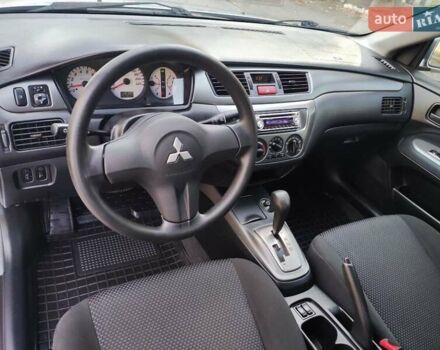 Сірий Міцубісі Lancer, об'ємом двигуна 1.58 л та пробігом 122 тис. км за 6300 $, фото 39 на Automoto.ua