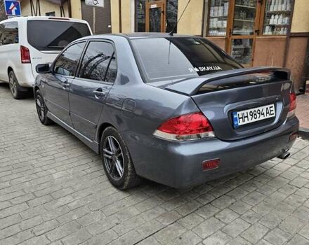 Серый Мицубиси Лансер, объемом двигателя 1.58 л и пробегом 260 тыс. км за 3700 $, фото 2 на Automoto.ua