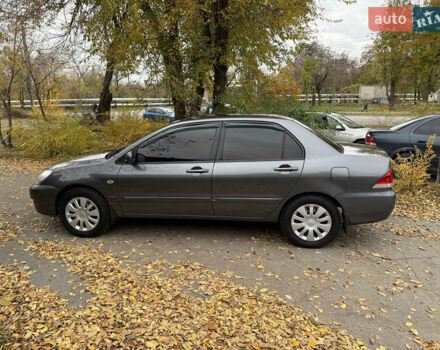 Сірий Міцубісі Lancer, об'ємом двигуна 1.58 л та пробігом 247 тис. км за 4900 $, фото 12 на Automoto.ua