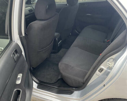 Серый Мицубиси Лансер, объемом двигателя 1.58 л и пробегом 240 тыс. км за 5500 $, фото 6 на Automoto.ua