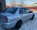 Сірий Міцубісі Lancer, об'ємом двигуна 1.6 л та пробігом 300 тис. км за 3450 $, фото 3 на Automoto.ua