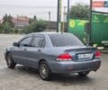 Серый Мицубиси Лансер, объемом двигателя 1.58 л и пробегом 300 тыс. км за 3999 $, фото 5 на Automoto.ua