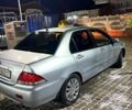 Сірий Міцубісі Lancer, об'ємом двигуна 1.6 л та пробігом 244 тис. км за 3900 $, фото 2 на Automoto.ua