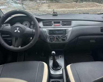 Сірий Міцубісі Lancer, об'ємом двигуна 1.58 л та пробігом 210 тис. км за 1300 $, фото 1 на Automoto.ua