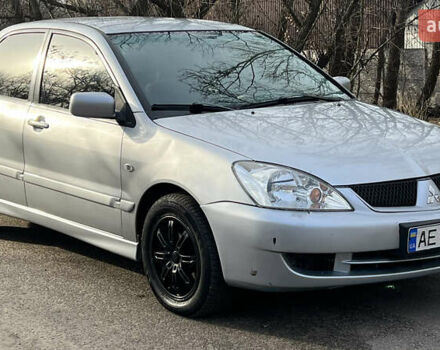 Серый Мицубиси Лансер, объемом двигателя 1.58 л и пробегом 290 тыс. км за 3750 $, фото 4 на Automoto.ua