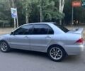 Серый Мицубиси Лансер, объемом двигателя 1.6 л и пробегом 300 тыс. км за 3799 $, фото 1 на Automoto.ua