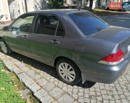 Серый Мицубиси Лансер, объемом двигателя 1.6 л и пробегом 205 тыс. км за 3800 $, фото 6 на Automoto.ua