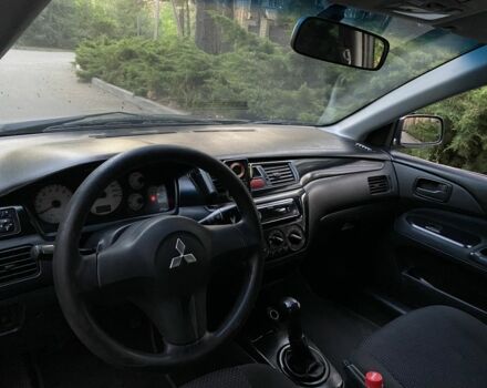 Серый Мицубиси Лансер, объемом двигателя 1.6 л и пробегом 250 тыс. км за 3999 $, фото 6 на Automoto.ua