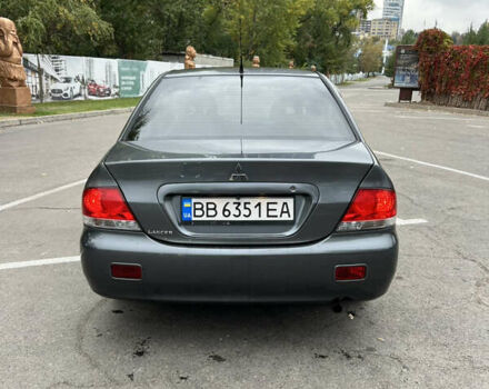 Сірий Міцубісі Lancer, об'ємом двигуна 1.58 л та пробігом 176 тис. км за 4700 $, фото 3 на Automoto.ua
