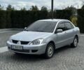 Серый Мицубиси Лансер, объемом двигателя 1.6 л и пробегом 250 тыс. км за 4999 $, фото 1 на Automoto.ua