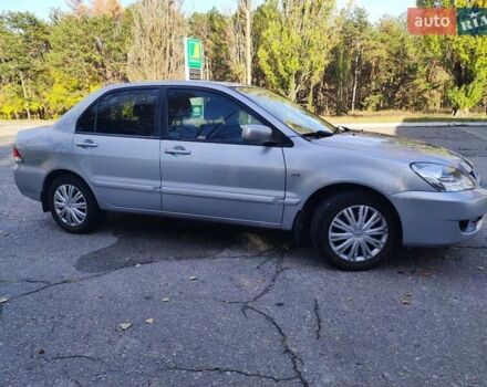 Сірий Міцубісі Lancer, об'ємом двигуна 1.58 л та пробігом 122 тис. км за 6300 $, фото 1 на Automoto.ua