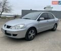 Сірий Міцубісі Lancer, об'ємом двигуна 1.59 л та пробігом 350 тис. км за 4000 $, фото 1 на Automoto.ua