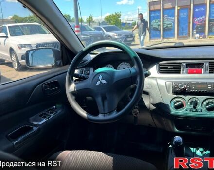 Серый Мицубиси Лансер, объемом двигателя 1.6 л и пробегом 130 тыс. км за 3999 $, фото 10 на Automoto.ua