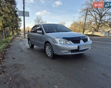 Сірий Міцубісі Lancer, об'ємом двигуна 1.58 л та пробігом 235 тис. км за 5200 $, фото 3 на Automoto.ua
