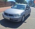 Сірий Міцубісі Lancer, об'ємом двигуна 1.6 л та пробігом 264 тис. км за 2600 $, фото 1 на Automoto.ua