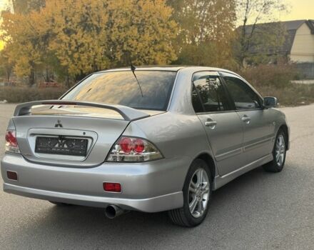 Серый Мицубиси Лансер, объемом двигателя 2 л и пробегом 185 тыс. км за 4600 $, фото 4 на Automoto.ua