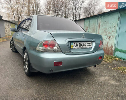 Серый Мицубиси Лансер, объемом двигателя 1.58 л и пробегом 205 тыс. км за 4750 $, фото 5 на Automoto.ua