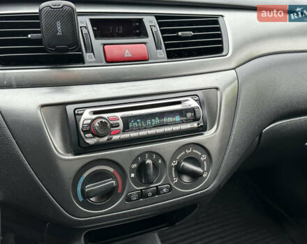 Серый Мицубиси Лансер, объемом двигателя 1.6 л и пробегом 116 тыс. км за 5050 $, фото 19 на Automoto.ua