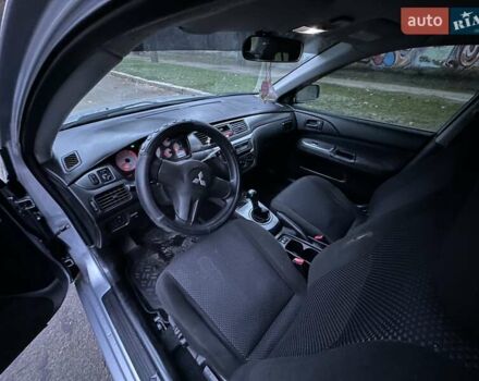 Серый Мицубиси Лансер, объемом двигателя 1.6 л и пробегом 210 тыс. км за 4600 $, фото 3 на Automoto.ua