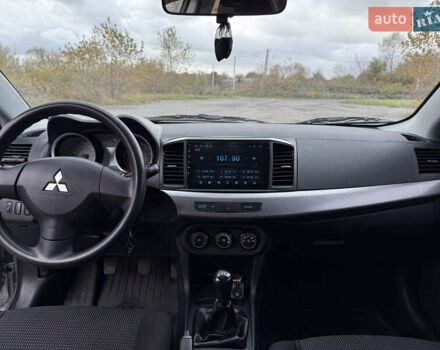 Серый Мицубиси Лансер, объемом двигателя 1.5 л и пробегом 97 тыс. км за 7300 $, фото 23 на Automoto.ua