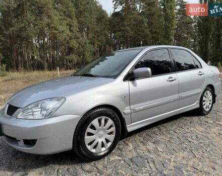 Серый Мицубиси Лансер, объемом двигателя 1.6 л и пробегом 200 тыс. км за 4400 $, фото 1 на Automoto.ua