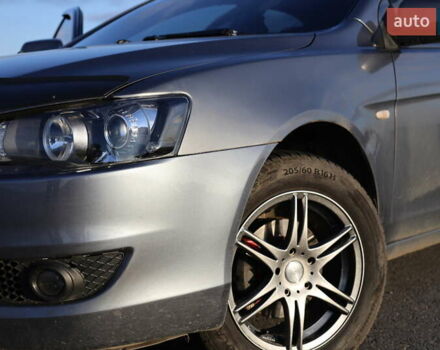 Серый Мицубиси Лансер, объемом двигателя 1.5 л и пробегом 330 тыс. км за 5250 $, фото 1 на Automoto.ua