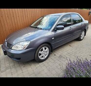 Сірий Міцубісі Lancer, об'ємом двигуна 1.6 л та пробігом 174 тис. км за 5850 $, фото 8 на Automoto.ua