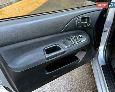 Сірий Міцубісі Lancer, об'ємом двигуна 1.6 л та пробігом 395 тис. км за 4900 $, фото 14 на Automoto.ua