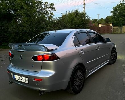 Серый Мицубиси Лансер, объемом двигателя 2 л и пробегом 220 тыс. км за 6500 $, фото 1 на Automoto.ua