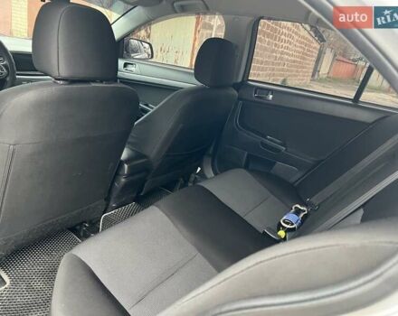 Серый Мицубиси Лансер, объемом двигателя 2 л и пробегом 180 тыс. км за 6799 $, фото 8 на Automoto.ua