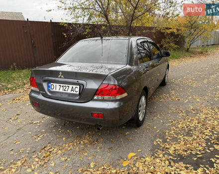 Сірий Міцубісі Lancer, об'ємом двигуна 1.58 л та пробігом 247 тис. км за 4900 $, фото 5 на Automoto.ua
