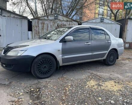 Сірий Міцубісі Lancer, об'ємом двигуна 1.58 л та пробігом 305 тис. км за 3300 $, фото 1 на Automoto.ua