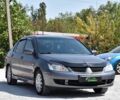 Серый Мицубиси Лансер, объемом двигателя 1.6 л и пробегом 335 тыс. км за 4500 $, фото 1 на Automoto.ua