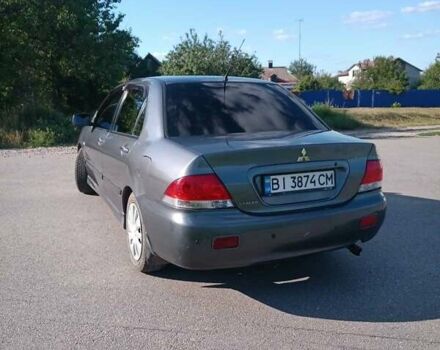 Серый Мицубиси Лансер, объемом двигателя 1.58 л и пробегом 300 тыс. км за 4400 $, фото 5 на Automoto.ua