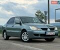 Серый Мицубиси Лансер, объемом двигателя 1.6 л и пробегом 345 тыс. км за 3950 $, фото 1 на Automoto.ua