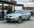 Сірий Міцубісі Lancer, об'ємом двигуна 1.58 л та пробігом 166 тис. км за 5200 $, фото 1 на Automoto.ua