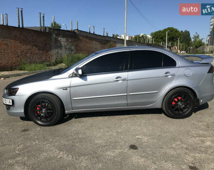 Серый Мицубиси Лансер, объемом двигателя 2 л и пробегом 256 тыс. км за 7000 $, фото 1 на Automoto.ua