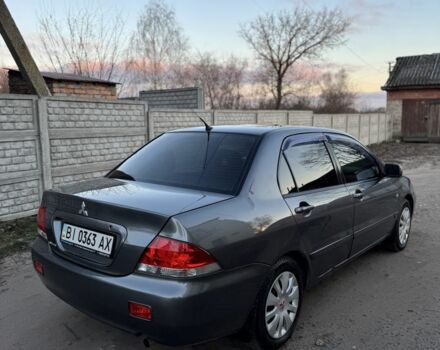Серый Мицубиси Лансер, объемом двигателя 1.6 л и пробегом 225 тыс. км за 3350 $, фото 3 на Automoto.ua